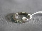 a ring that is on a string on a table