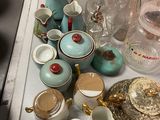many different types of glass vases on the table