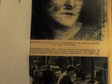 un livre sur lequel figure la photo d'une femme, avec un bout de papier sur lequel est accrochée une note