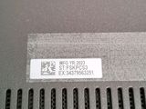 the back of a laptop computer with a sticker on it ' s side