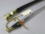 an image of a sword with a black handle and a gold handle