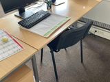a desk with two computer monitors and a keyboard on it