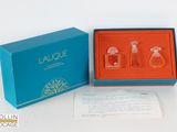 an image of a blue box with three bottles of perfume in it