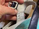 a person that is putting something in a shoe