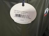 a tag on the jacket of a man on the field