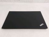 a laptop that is sitting on a white surface