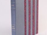 a book that is sitting on a white surface