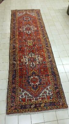 a long rug on the floor in a room