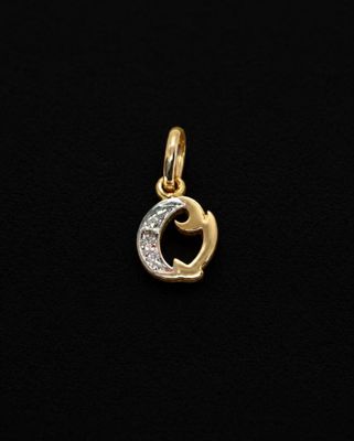 a gold and diamond pendant with the letter c on it