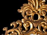 a gold mirror with a black background and a black background