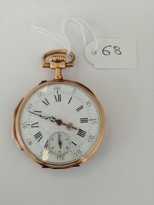 a gold pocket watch with roman numerals on it