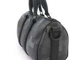 louis vuittou bag in black and grey checkered leather