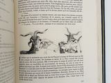 an open book with illustrations of animals and birds on it