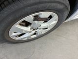 a close up of a tire on a car ' s rim
