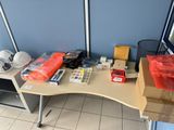 a desk with a lot of items on it
