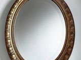 a mirror hanging on the wall in a room