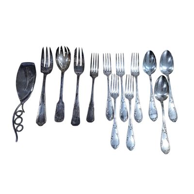 a lot of spoons and forks on a white background