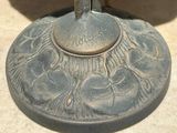 a close up of a candle holder with a bird on it