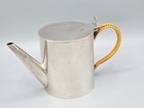 silver metal watering can with a yellow handle on a white background