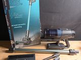 a box of vacuum cleaners and other items on a table