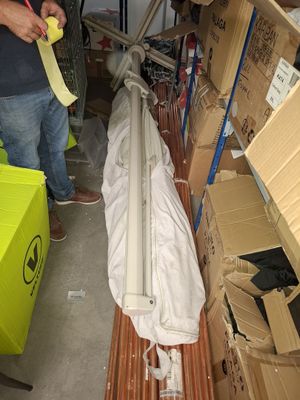 a man standing in a room with a lot of boxes on the floor