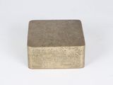 an old brass box with a drawing on it sitting on a white surface