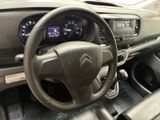 the interior of a car with a steering wheel and dashboard controls