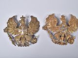 pair of two gold eagle brooches on a white background