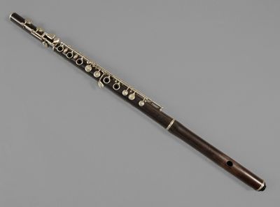 a close up of a flute on a gray surface