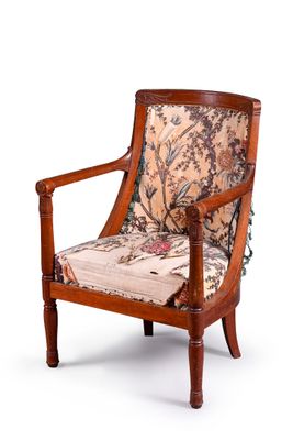 a wooden chair with a floral upholstered seat