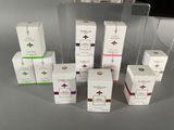 several boxes of different types of perfume sitting on top of a table