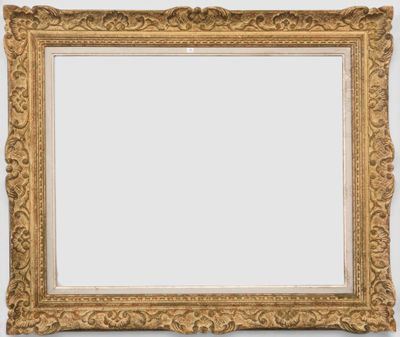 a gold framed mirror with ornate scrolls and scrolls on a white background