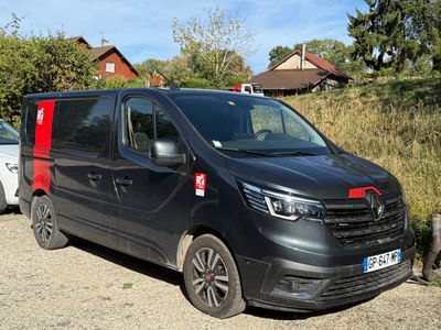 a black van that is parked on the side of the road