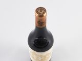 a bottle of wine that is sitting on a table