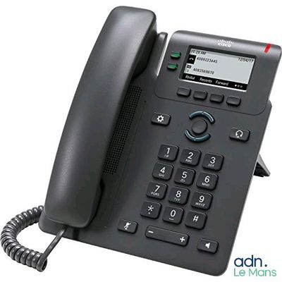 a black telephone that is sitting on a white surface