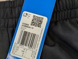 the back of a pair of black pants with a barcode on it