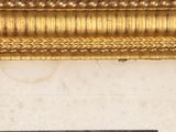 a picture of a gold frame with a picture on it