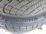 a close up of a tire on a wooden surface