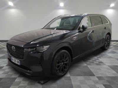 the mazda cx - 5 is parked on a checkered floor