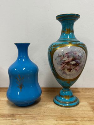 three vases that are sitting on a wooden table