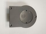 a close up of a metal object on a white surface