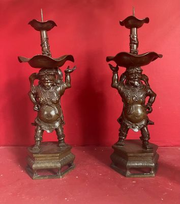 pair of antique chinese bronze figurines of a man and a woman