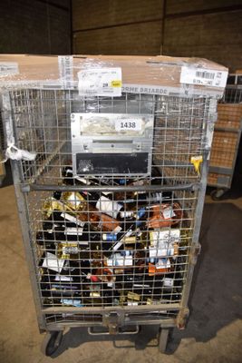 a metal cart with a bunch of items inside of it