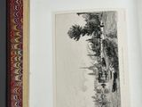 an open book with a drawing of a landscape in it