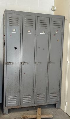 an image of a room with lockers and a clock on the wall
