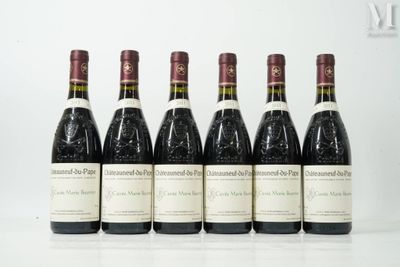 six bottles of wine are lined up on a table