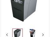 a black and white photo of a paper shredder on a white background
