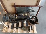 a suitcase and a pair of shoes sitting on a pallet