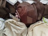 a pile of hats sitting on top of a table