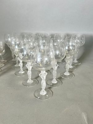 a lot of wine glasses sitting on a table